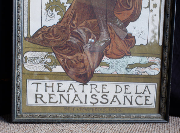 A framed vintage-style poster or print leaning on a textured beige surface, showing an illustrated figure in brown robes with the text 'THEATRE DE LA RENAISSANCE' and '1857 - Eugène Pérrot - Bougie'.